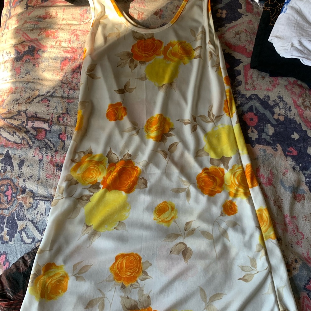 Small, floral dress. See through material